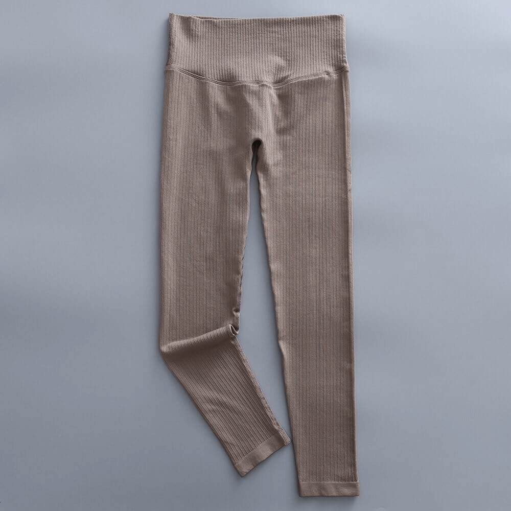 Brown sports seamless high waist ribbed leggings for women, ideal for yoga and exercise. Lightweight, comfortable nylon spandex blend.